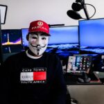 a person wearing a mask and a red hat